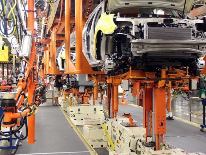 In this Aug. 1, 2013 photo provided by General Motors, cars are assembled at the General Motors Spring Hill Manufacturing Plant in Spring Hill, Tenn. General Motors announced Tuesday, Aug. 6, 2013, that it is spending another $167 million at the factory so it can build two new midsize vehicles. (AP Photo/General Motors) (Credit: AP)