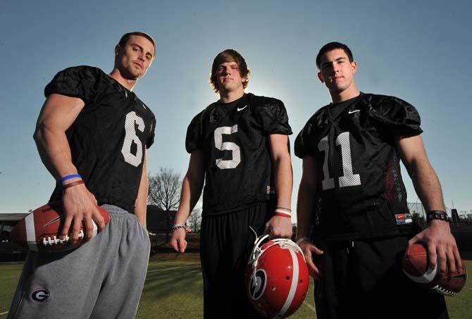 FILE - In this Feb. 26, 2010, file photo, Georgia quarterbacks Logan Gray (6), Zach Mettenberger (5) and Aaron Murray (11) pose for a photo in Athens, Ga. After taking a circuitous and sometimes troubled route from Georgia to junior college and now LSU, Mettenberger is headed back to Athens, where his mom still works in the Bulldogs' football office. (AP Photo/Atlanta Journal Constitution, Brant Sanderlin, File) MARIETTA DAILY OUT, GWINNETT DAILY POST OUT LOCAL TV OUT (WXIA, WGCL, FOX 5)