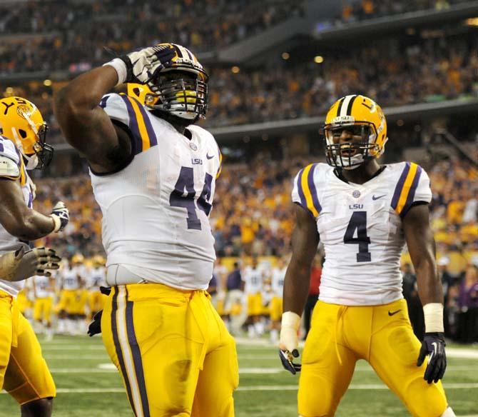 LSU senior full back J.C. Copeland (44) salutes after scoring Aug. 31, 2013 during the 37-27 victory against TCU in the Cowboys Classic at AT&amp;T Stadium in Arlington, Texas.