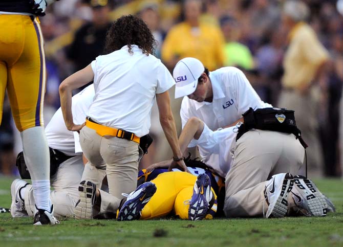 LSU senior linebacker Lamin Barrow (18) is injured Saturday, September 14, 2013 in the Tigers' 45-13 victory against Kent State.