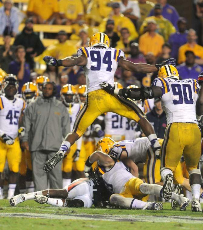 LSU sophomore defensive end Danielle Hunter (94) jumps over a play Saturday, September 21, 2013, during the Tigers' 35-21 victory against Auburn in Tiger Stadium.