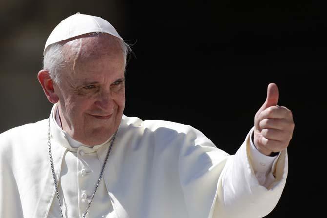 Pope Francis gives his thumb up as he leaves at the end of his weekly general audience in St. Peter's square at the Vatican, Wednesday, Sept. 4, 2013. (AP Photo/Riccardo De Luca)