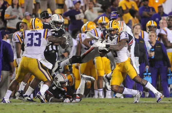 LSU junior wide receiver Odell Beckham Jr. (3) attempts to ward off an Auburn player Saturday, September 21, 2013, during the Tigers' 35-21 victory against Auburn in Tiger Stadium.