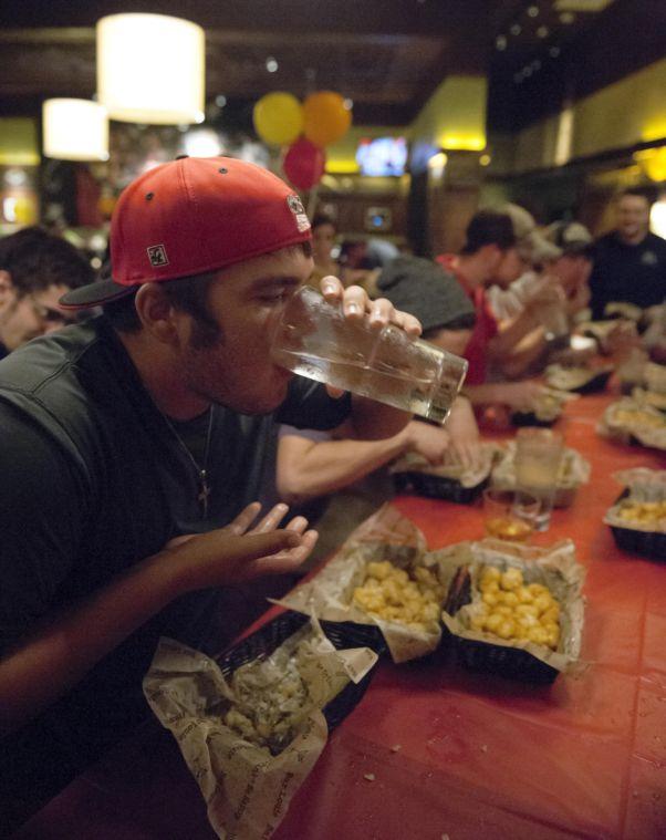 Rock The Tot competitor Chase Caldarera pauses to drinks water Thursday night, Sept. 19, 2013, at Bar Louie.