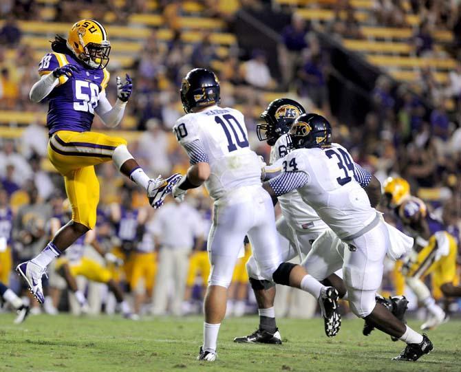 LSU senior linebacker Tahj Jones (58) _____ Saturdy, Sept. 14, 2013 during the Tiger's 45-13 victory at Tiger Stadium