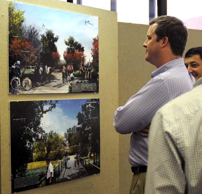 Spectators look over the designs that are in the running for the Battle of New Orleans Monument on Friday, Sept. 27, 2013 at the LSU Design Building.