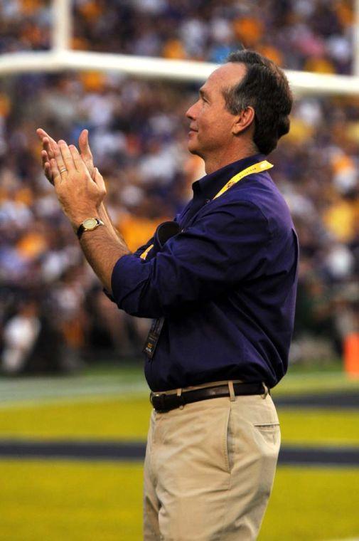 LSU president and chancellor F. King Alexander claps after being presented Sept. 7,2013 before the 56-17 victory against UAB in Tiger Stadium