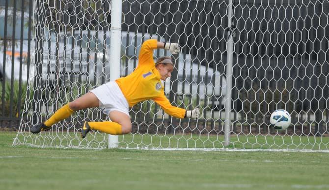 LSU senior goalkeeper Megan Kinneman (1) dives to save a shot on goal Sunday, Sept. 29, 2013 against the Tiger's 3-2 vicotry against Mississippi State.