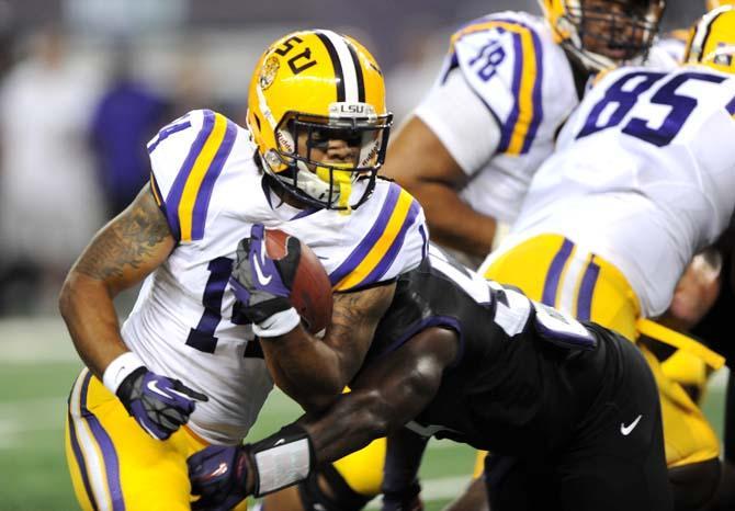 LSU junior running back Terrence Magee (14) maneuvers downfield Saturday, August 31, 2013 during the Tigers' 32-27 victory against TCU in the 2013 Cowboys Classic at AT&amp;T Stadium in Arlington, Texas.