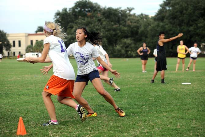 LSU environmental engineering senior Allyson Lutz walks through drills Tuesday, Sept. 17, 2013 with fellow club veterans at the LSU parade grounds *see Cole for other names*