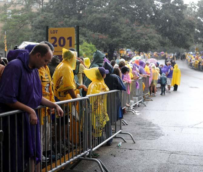 Rain falls on LSU fans Saturday, September 21, 2013, before the LSU vs. Auburn game in Tiger Stadium.