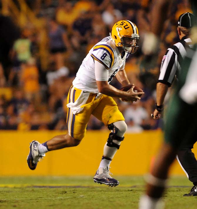 LSU senior quarterback Zach Mettenberger (8) runs the ball Sept. 7, 2013 during the Tigers' 56-17 victory against UAB in Tiger Stadium