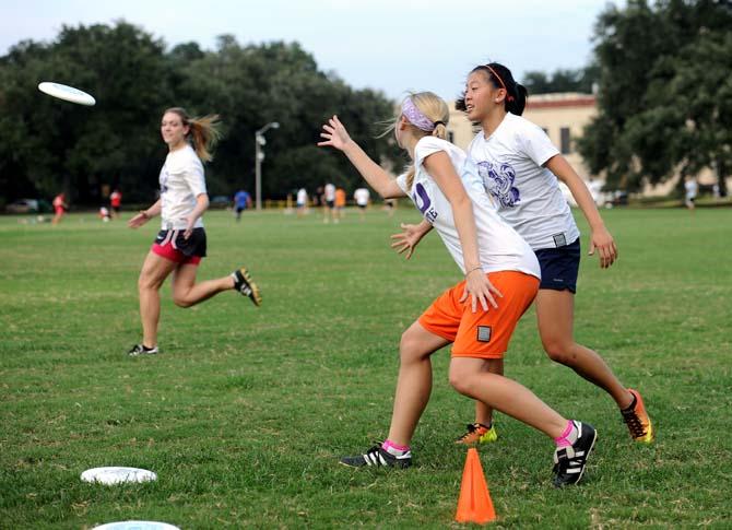 LSU environmental engineering senior Allyson Lutz walks through drills Tuesday, Sept. 17, 2013 with fellow club veterans at the LSU parade grounds *see Cole for other names*