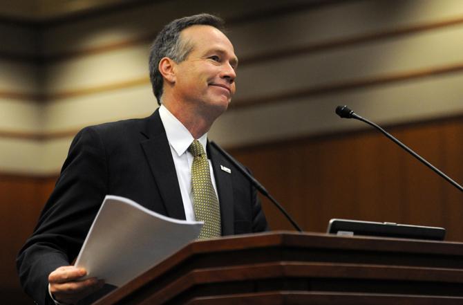 LSU President and Chancellor F. King Alexander smiles at a comment from the Board of Regents on Aug. 21, 2013 in the Louisiana Purchase Room located in the Claiborne Building in Downtown Baton Rouge.