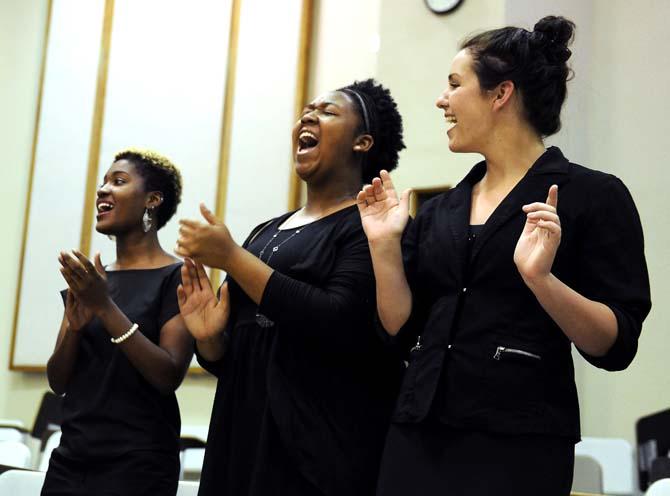 Biochemistry sophomore Megan Gilliam (center) sings at the LSU Gospel Choir's rehearsal Friday, September 6, 2013 in the LSU School of Music Building.