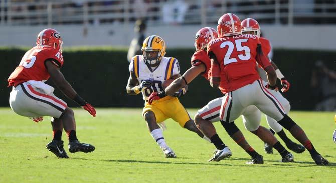 LSU junior wide receiver Jarvis Landry (80) moves around UGA defenders Saturday, Sept 28, 2013 during The Bulldogs' 44-41 victory against the Tigers in Sanford Stadium.