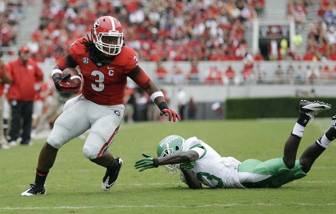 Georgia running back Todd Gurley (3) gets away from North Texas defensive back James Jones (13) as he runs for a touchdown in the first half of an NCAA college football game Saturday, Sept. 21, 2013 in Athens, Ga. (AP Photo/John Bazemore)