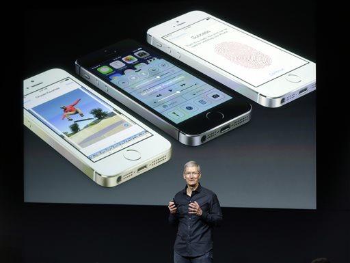 Tim Cook, CEO of Apple, speaks on stage during the introduction of the new iPhone 5s in Cupertino, Calif., Tuesday, Sept. 10, 2013. (AP Photo/Marcio Jose Sanchez)