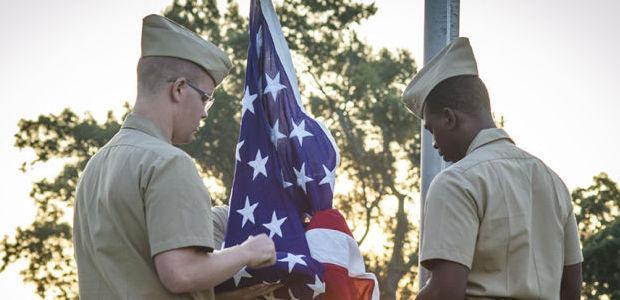 Navy ROTC students present the colors at morning practice at Southern University.