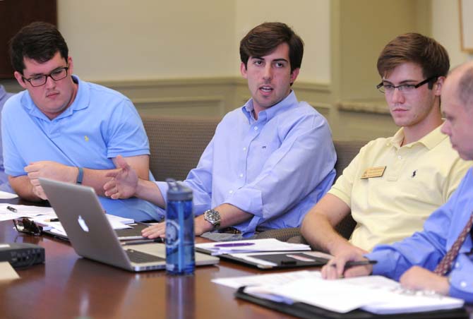 Graduate College Council President Thomas Rogers (left), Student Government President John Woodard (middle) and Trey Schwartzenburg, SG Senate speaker pro tempore and College of Science senator, (right) discuss the student technology fee Sept. 16, 2013, at a meeting in Thomas D. Boyd Hall.