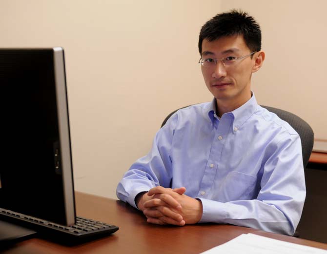 Assistant Professor at the School of Electrical Engineering Computer Science Dr. Feng Chen sits at his desk on Tuesday, September 10, 2013, in Patrick F. Taylor hall. Dr. Chen is one of a few new faculty in the School of Electrical Engineering Computer Science, only having started at LSU on August 19.