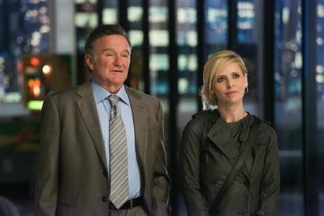 This publicity image released by CBS shows Robin Williams, left, and Sarah Michelle Gellar in a scene from the pilot episode of "The Crazy Ones," a new CBS comedy premiering Thursday, Sept. 26 at 9 p.m. EST. (AP Photo/CBS, Richard Cartwright)