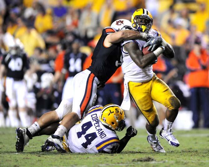 LSU sophomore running back Jeremy Hill (33) attempts to evade a defender Saturday, Sept. 21, 2013 during the Tigers' matchup against Auburn in Tiger Stadium.