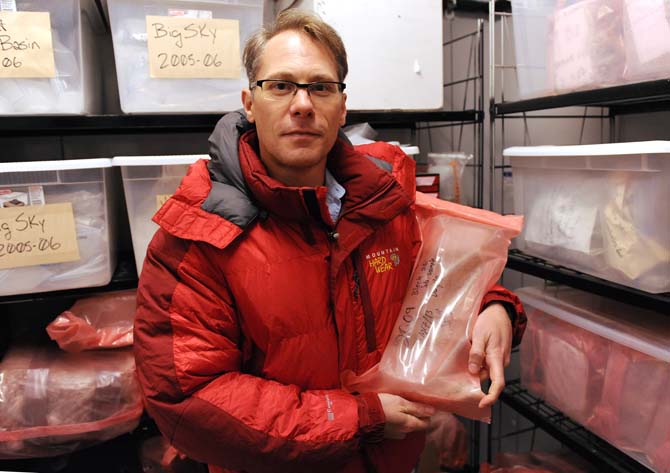 Biological science associate professor Brent Christner holds a sample of ice from Antarctica on Wednesday, October 30, 2013 in the Life Sciences building.