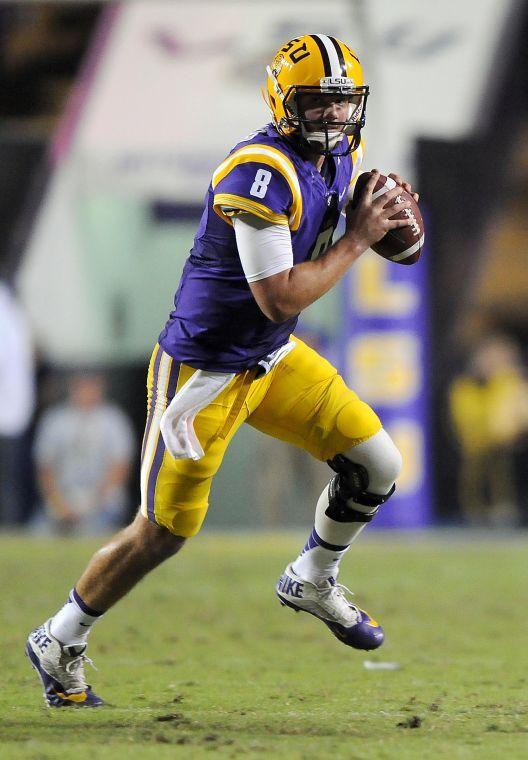 LSU senior quarter back Zach Mettenberger (8) runs the ball Saturday night, Oct. 26, 2013 during the Tigers' 48-16 win against Furman in Tiger Stadium.