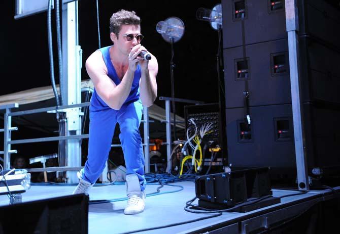 Nicholas Louis "Nick" Noonan, of Karmin, performs Thursday, Oct. 24 2013, at the LSU Homecoming Concert held at the parade grounds