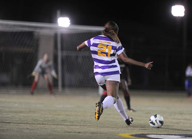 LSU senior defender Nina Anderson (21) drives the ball downfield Friday, Oct. 25, 2013 during the Tigers' 2-1 loss against Georgia.