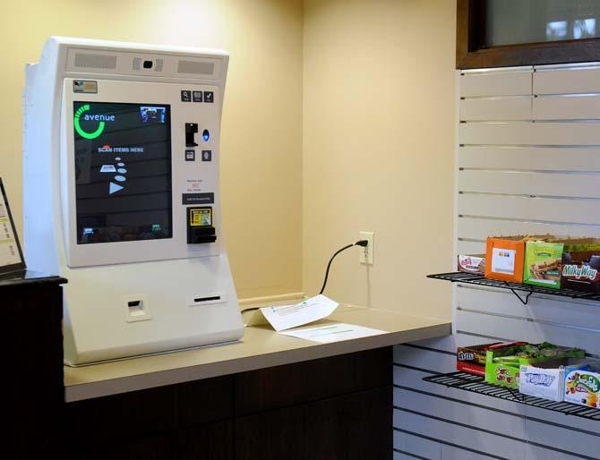 The new check-out machine for the snack shop stands on display in the Union. This machine replaced the job that a person used to occupy.