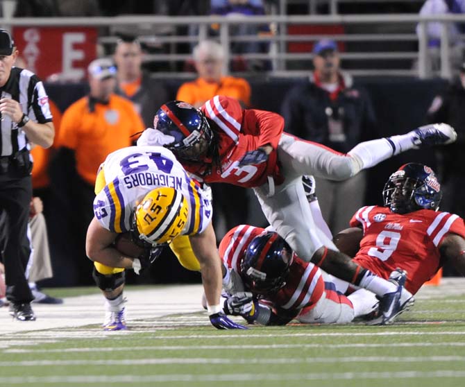 Ole Miss freshman running back Eugene Brazley (3) tackles LSU senior fullback Connor Neighbors (43) on Saturday, October 19, 2013 during the Tigers' 27-24 loss against Ole Miss at Vaught-Hemingway Stadium.