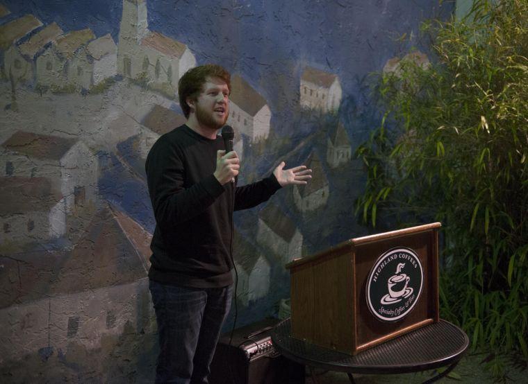 Drake McCrimmon performs a monologue Wednesday night, Oct. 23, 2013 during Queer Confessions: A Spectrum Poetry Night at Highland Coffees.