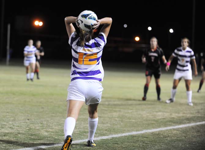 LSU sophomore midfielder Heather Magee (12) throws in the ball Friday, Oct. 25, 2013 during the Tigers's 2-1 loss to Georgia.