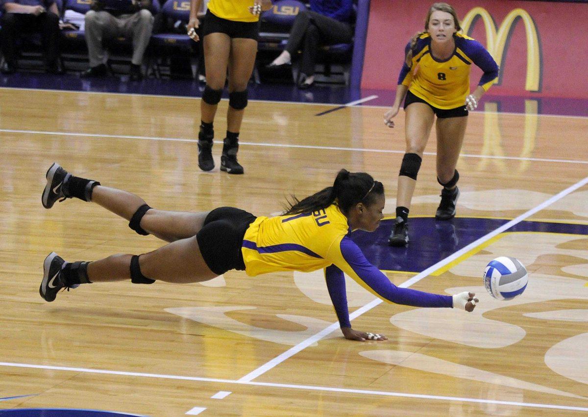 Sophomore middle blocker Khourtni Fears (1) dives for the ball Saturday, Oct. 5 at the Pete Maravich Assembly Center.