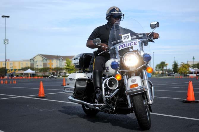 Officer Boris McKnight from LSUPD performs motorcycle maneuvers at the The 13th Annual Gulf Coast Police Motorcycle Skills Championship Friday, Oct. 18, 2013 in Gonzales. The championship is put on to benefit the Dream Day Foundation and St. Jude's Hospital.