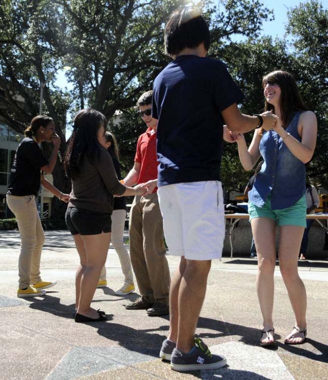 The Hispanic Student Cultural Society promotes Hispanic Heritage Month by offering Salsa dance lessons Wednesday, Oct. 9, 2013, in the Echo Circle of Free Speech Alley.