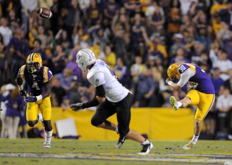 LSU junior place kicker James Hairston (30) kicks the ball downfield Saturday night, Oct. 26, 2013 during the Tigers' 48-16 win against Furman in Tiger Stadium.