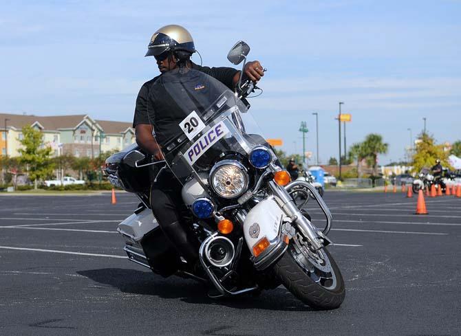 Officer Boris McKnight from LSUPD performs motorcycle maneuvers at the The 13th Annual Gulf Coast Police Motorcycle Skills Championship Friday, Oct. 18, 2013 in Gonzales. The championship is put on to benefit the Dream Day Foundation and St. Jude's Hospital.