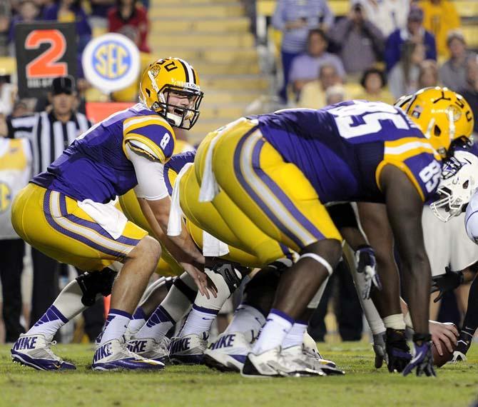 LSU senior quarter back Zach Mettenberger (8) directs the offensive lineSaturday, Oct. 26, 2013, during the Tigers' 48-16 win against Furman in Tiger Stadium.