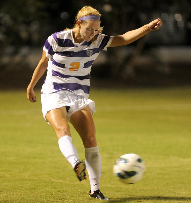 LSU senior defender Addie Eggleston (2) crosses the ball into the box Friday, Oct. 11, 2013 during the 1-0 victory against Mizzou at LSU Soccer Stadium.