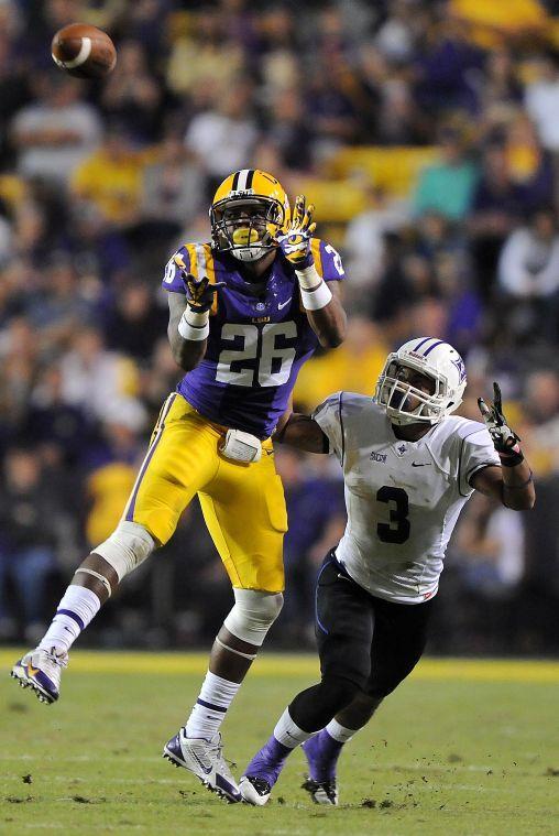 LSU junior safety Ronald Martin (26) intercepts a pass meant for Furman freshman wide receiver Andrej Suttles (3) on Saturday night, Oct. 26, 2013 during the Tigers' 48-16 win against Furman in Tiger Stadium.