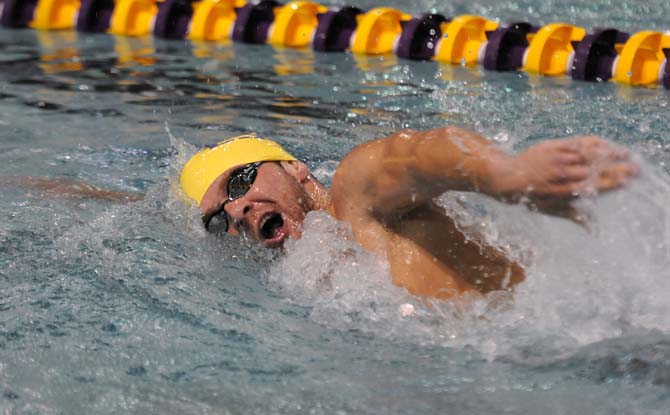 LSU junior Matt Schaefer takes a breath during the men's 1000 freestyle event on Friday October 18, 2013 at the LSU vs. Georgia swim meet in the Natatorium.