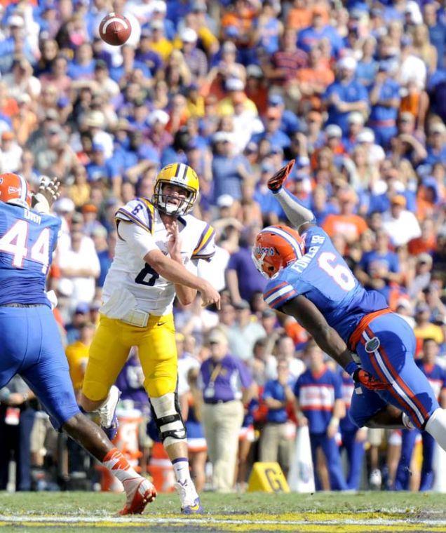 LSU senior quarterback Zach Mettenberger (8) throws the football downfield Saturday, Oct. 12, 2013 during the Tigers' 17-6 victory against Florida in Tiger Stadium.