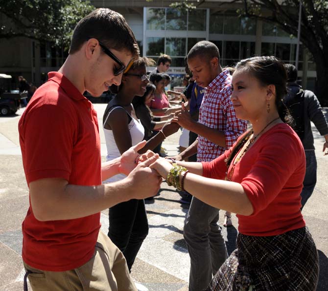 The Hispanic Student Cultural Society promotes Hispanic Heritage Month by offering Salsa dance lessons Wednesday, Oct. 9, 2013, in the Echo Circle of Free Speech Alley.