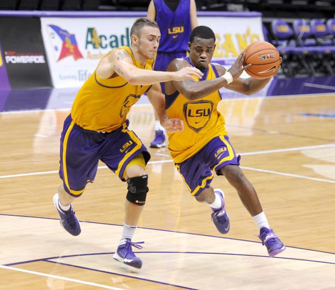 LSU senior guard junior guard Anthony Hickey (1) drives to the basket Tuesday, Oct. 1, 2013 during the men's basketball practice in the PMAC.