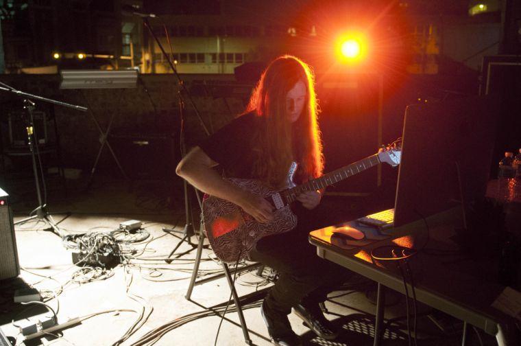 Christian Greenwood couples filtered guitar with dizzying and danceable beats Friday, Oct. 11, 2013 at the McNeill Street Pumping Station New Music Festival in Shreveport, Louisiana.