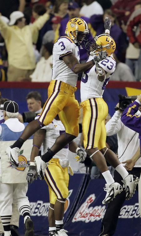 Louisiana State's Craig Davis (3) celebrates with teammate Xavier Carter (23) after he scored on a 51-yard touchdown reception against Miami in the second quarter of the Peach Bowl football game at the Georgia Dome in Atlanta on Friday, Dec. 30, 2005. (AP Photo/Bill Haber)