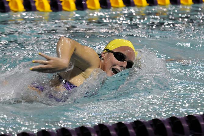 LSU sophomore Hallie Peterson takes a breath on Friday October 18, 2013 during the 1000 yard freestyle event at the LSU vs. Georgie swim meet in the Natatorium.